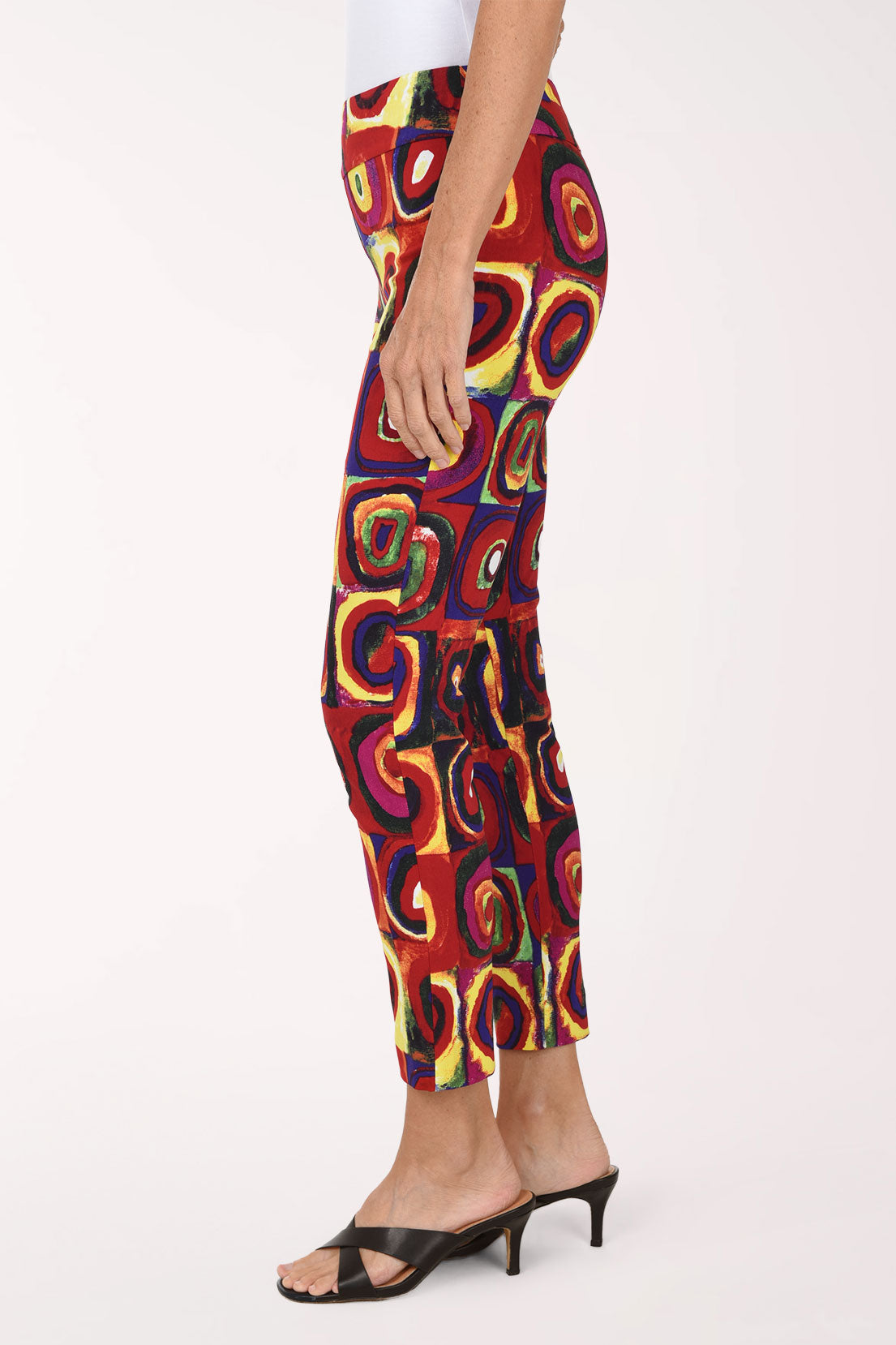 Women wearing a multicolored square and circular print pull-on ankle pants