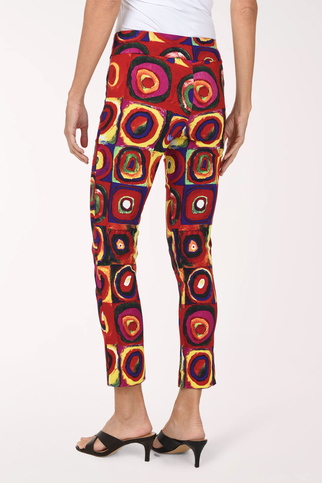Women wearing a multicolored square and circular print pull-on ankle pants