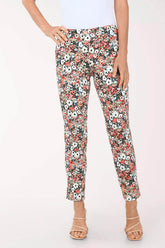 Floral patterned pants worn by a person on a white background