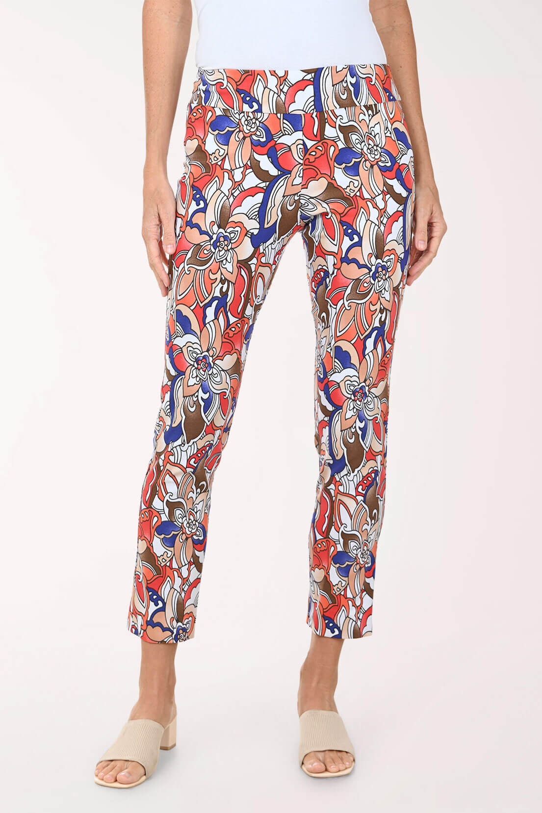Colorful patterned pants worn by a person on a white background