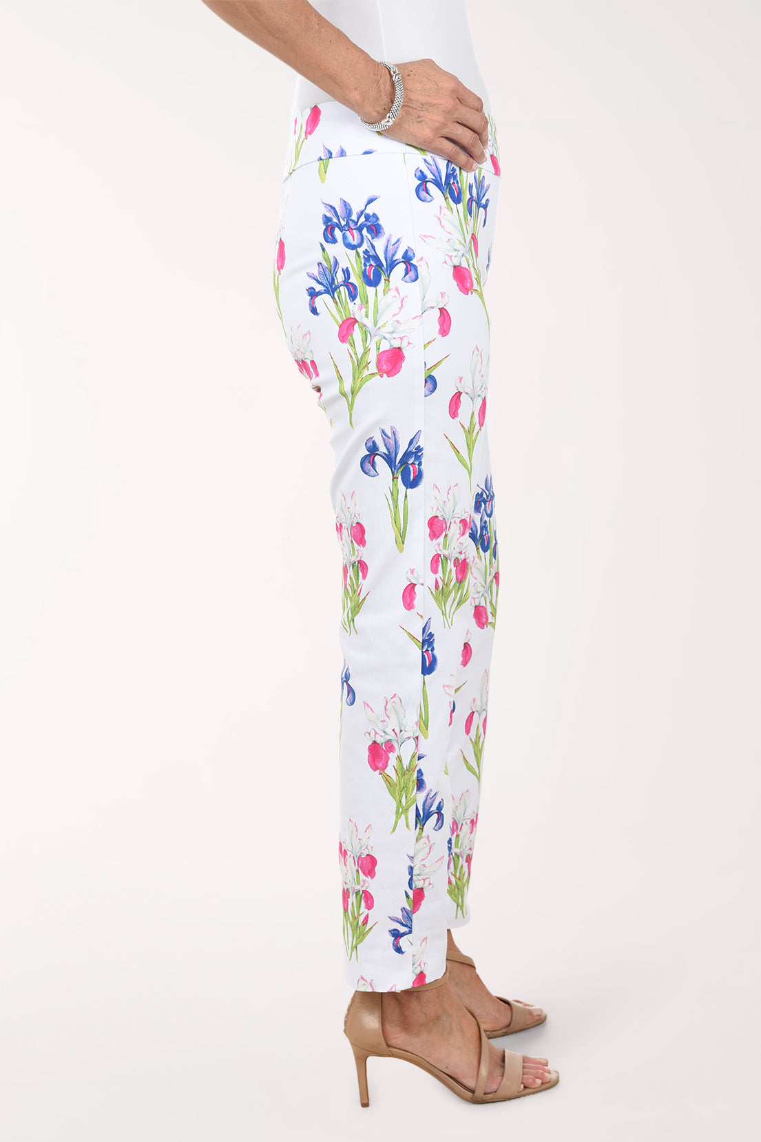 Floral-patterned pants worn by a person on a white background