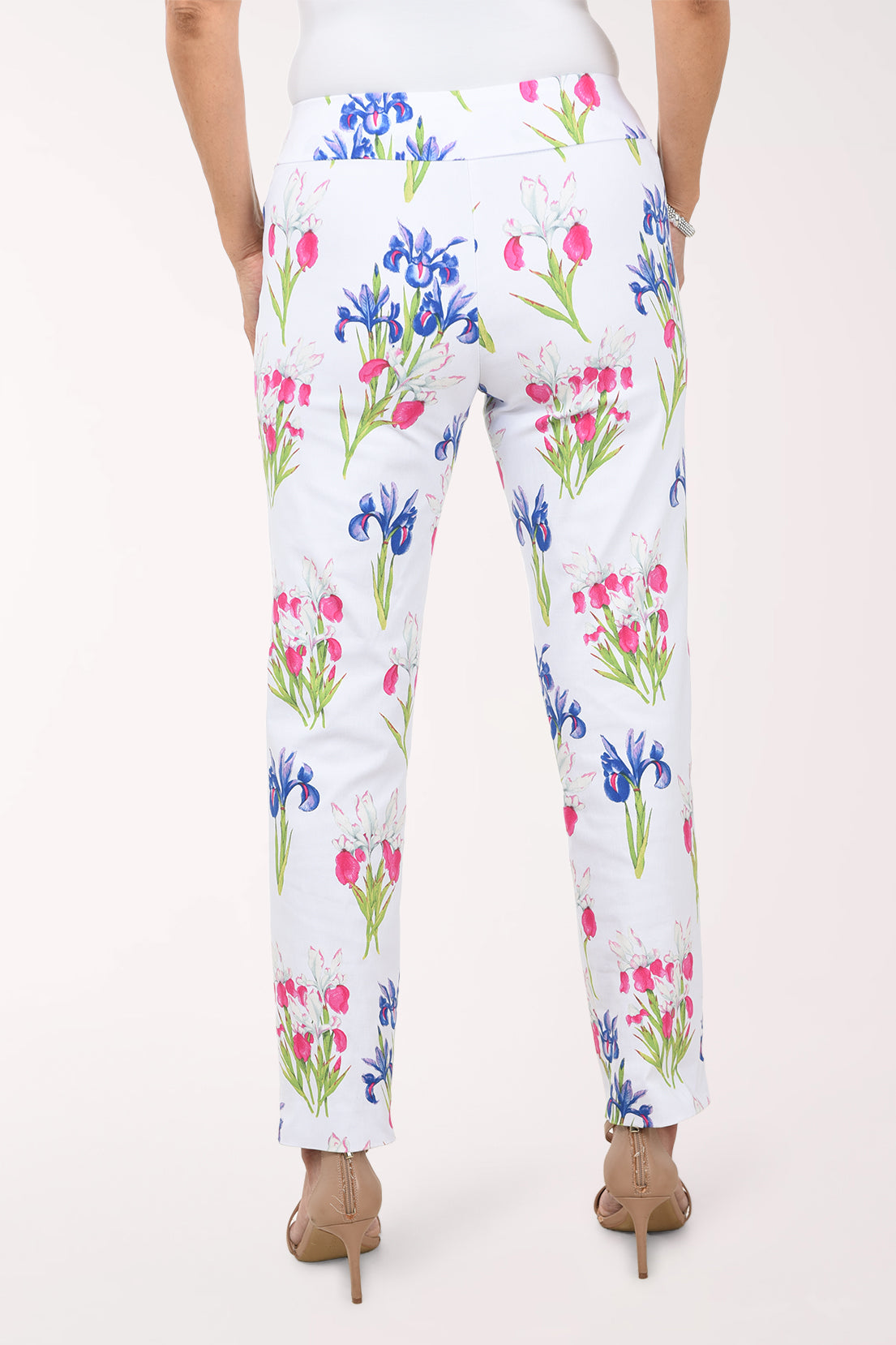 Floral-patterned pants worn by a person on a white background