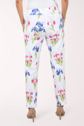 Floral-patterned pants worn by a person on a white background