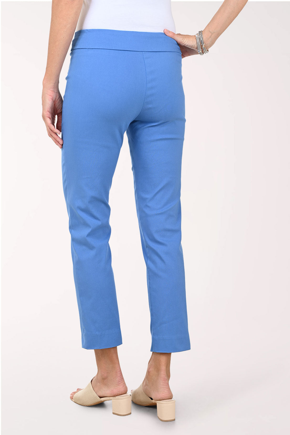 Person wearing blue pants on a white background