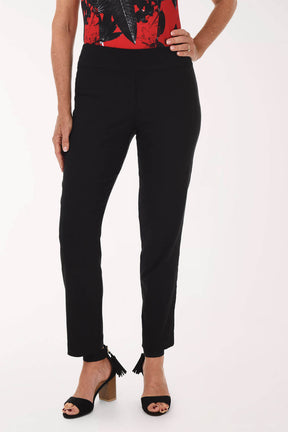 Black pants worn by a person on a white background