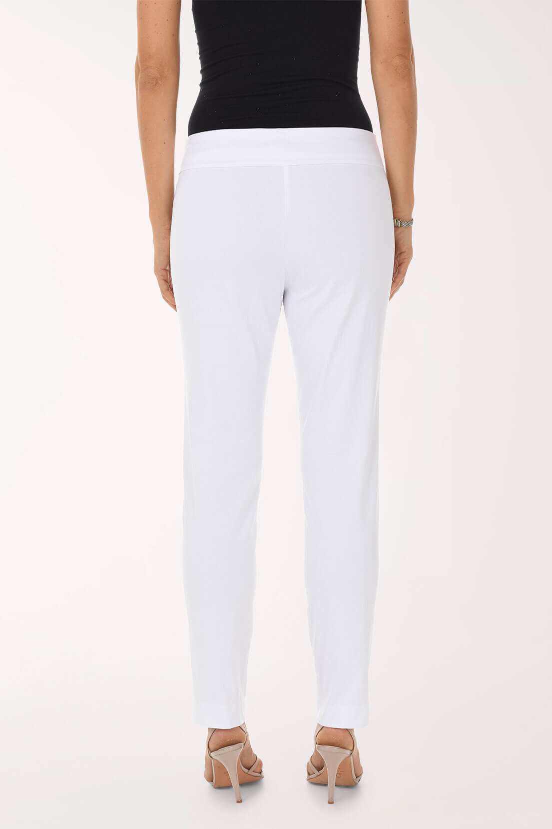 Person wearing white pants and a black top on a white background