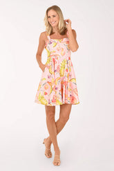 Woman wearing a floral dress on a white background