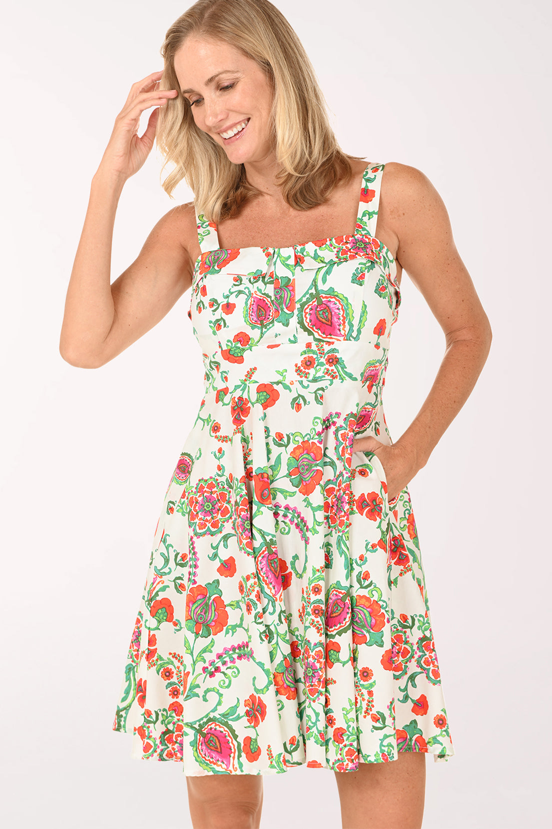 Woman wearing a floral dress on a white background