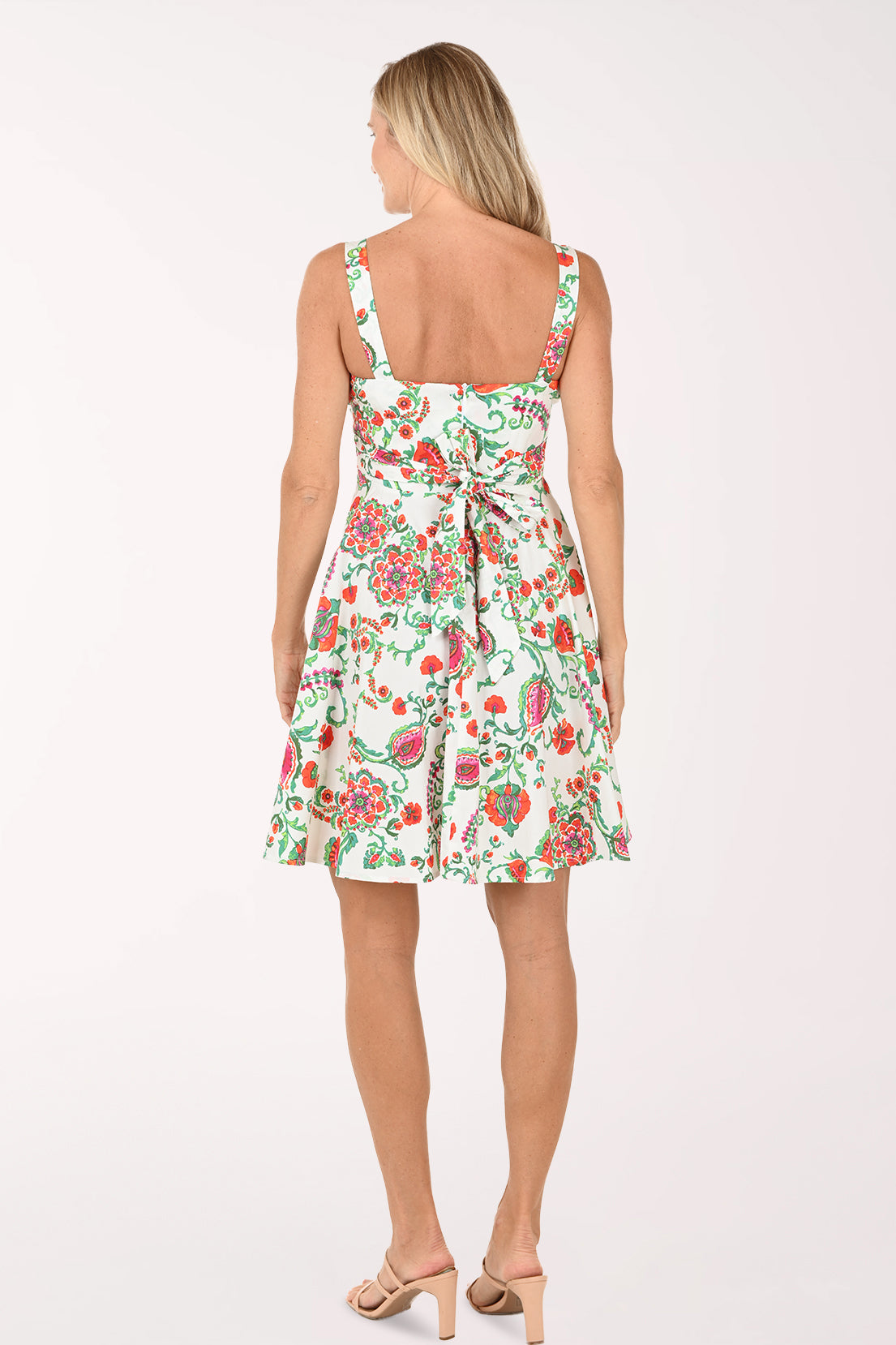 Woman wearing a floral dress on a white background