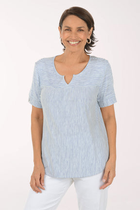 Woman wearing a blue and white striped shirt on a white background