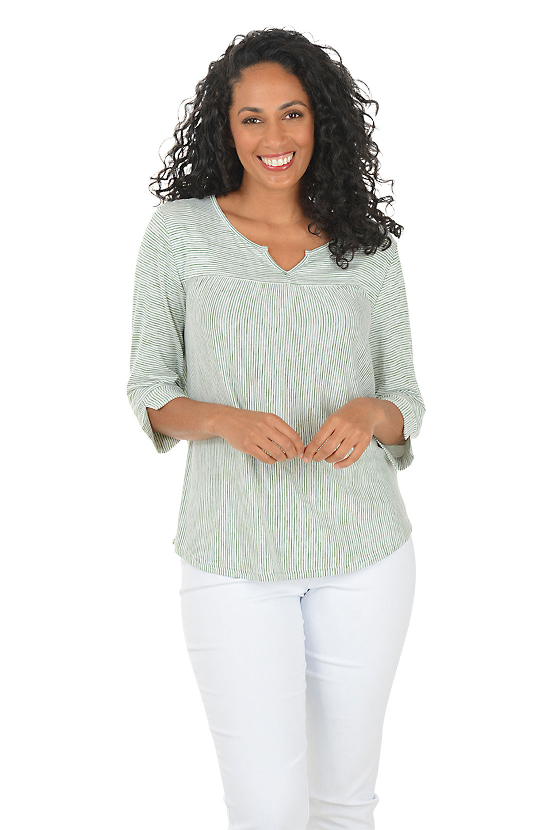 Woman wearing a green and white striped shirt and blue jeans on a white background.