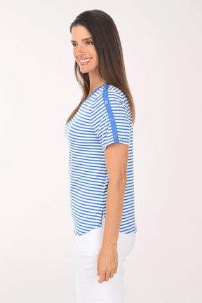 Woman wearing a blue and white striped shirt on a white background