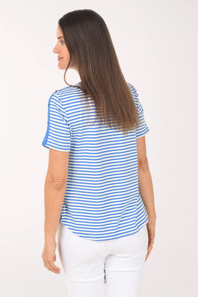 Woman wearing a blue and white striped shirt on a white background