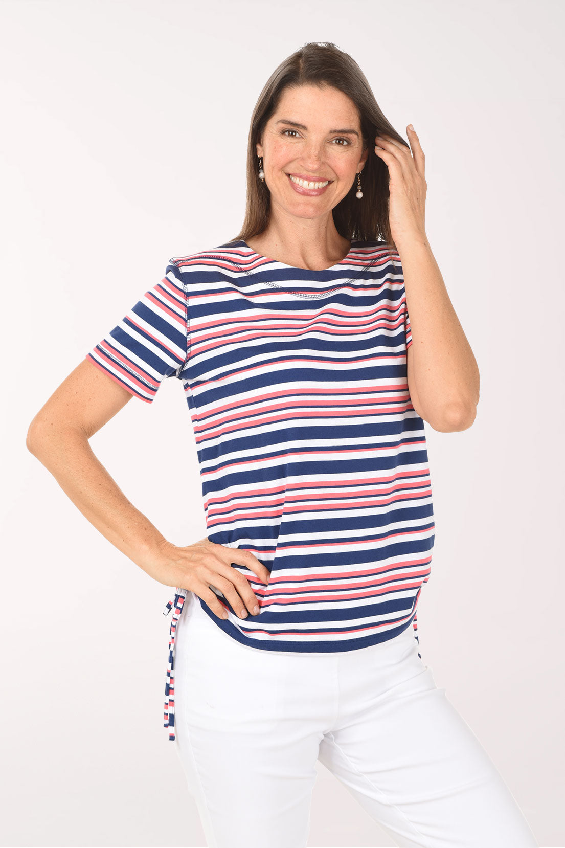 Woman wearing a striped shirt with a white background