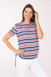 Woman wearing a striped shirt with a white background