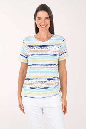 Woman wearing a colorful striped shirt on a white background
