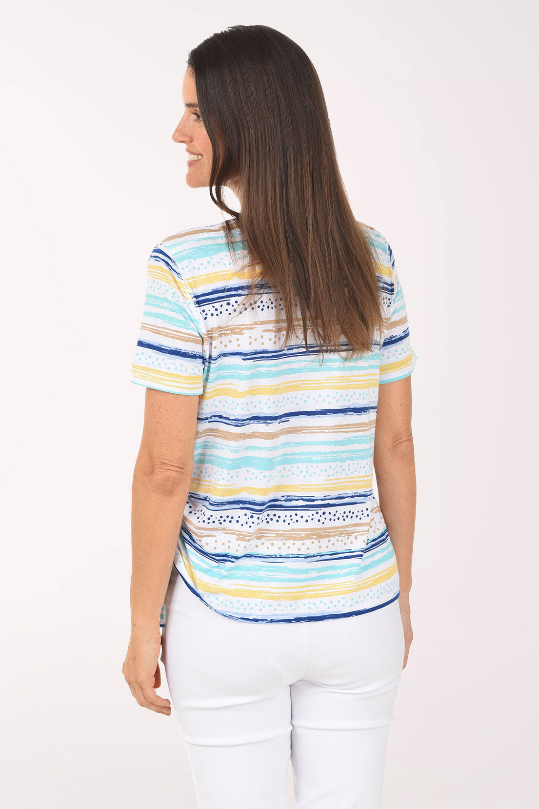 Woman wearing a colorful striped shirt on a white background