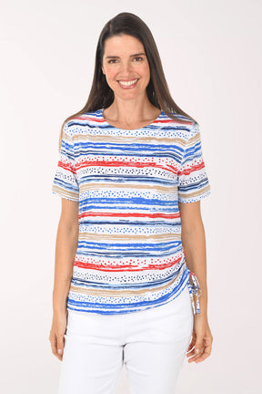 Woman wearing a colorful striped shirt on a white background
