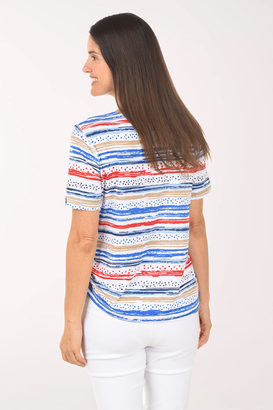 Woman wearing a colorful striped shirt on a white background