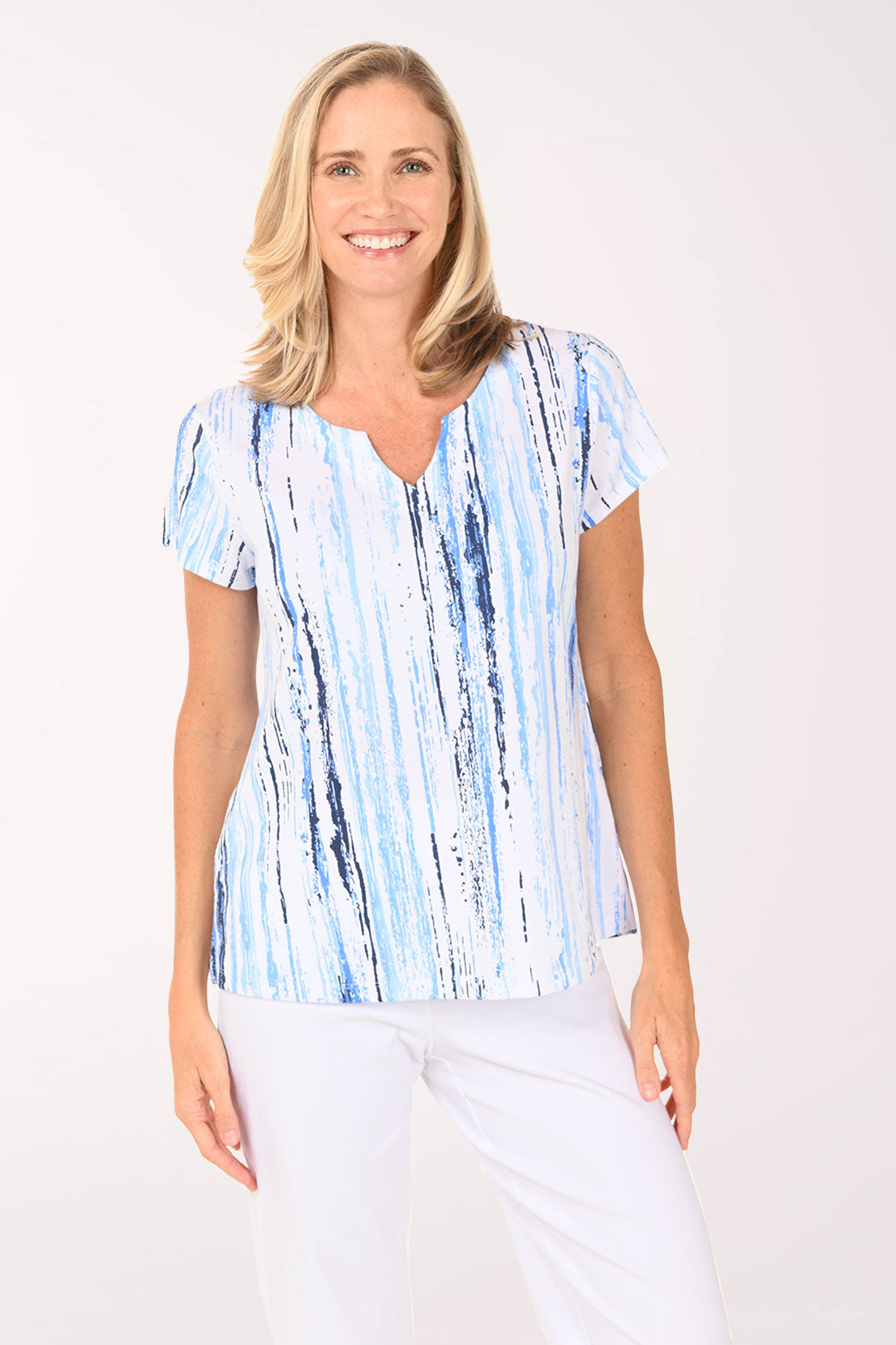 Woman wearing a short sleeve blue striped shirt.