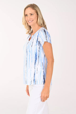 Woman wearing a short sleeve blue striped shirt.
