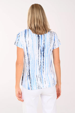 Woman wearing a short sleeve blue striped shirt.
