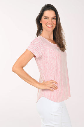 Woman wearing a red and white striped shirt on a white background
