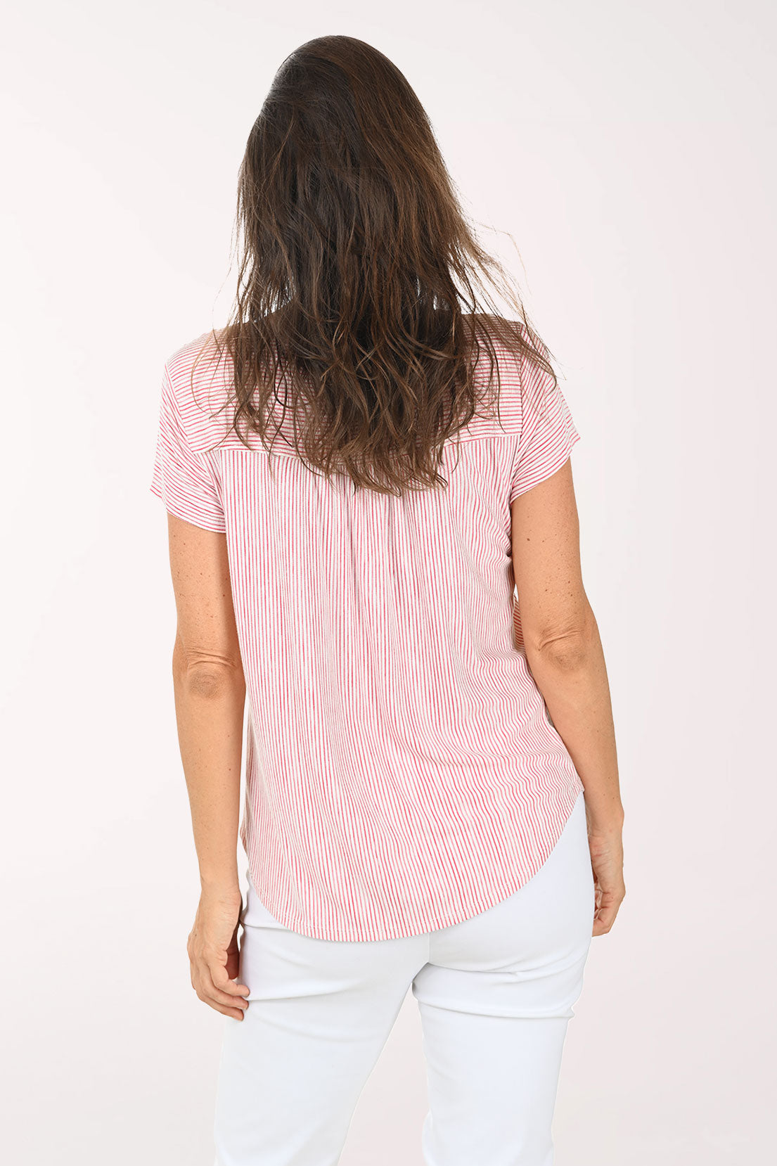 Woman wearing a red and white striped shirt on a white background