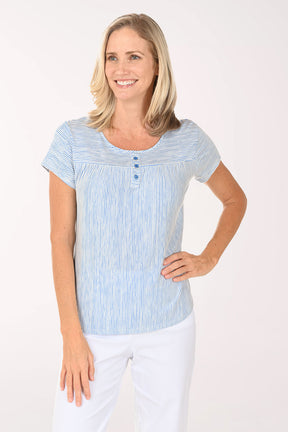Woman wearing a blue and white striped shirt on a white background