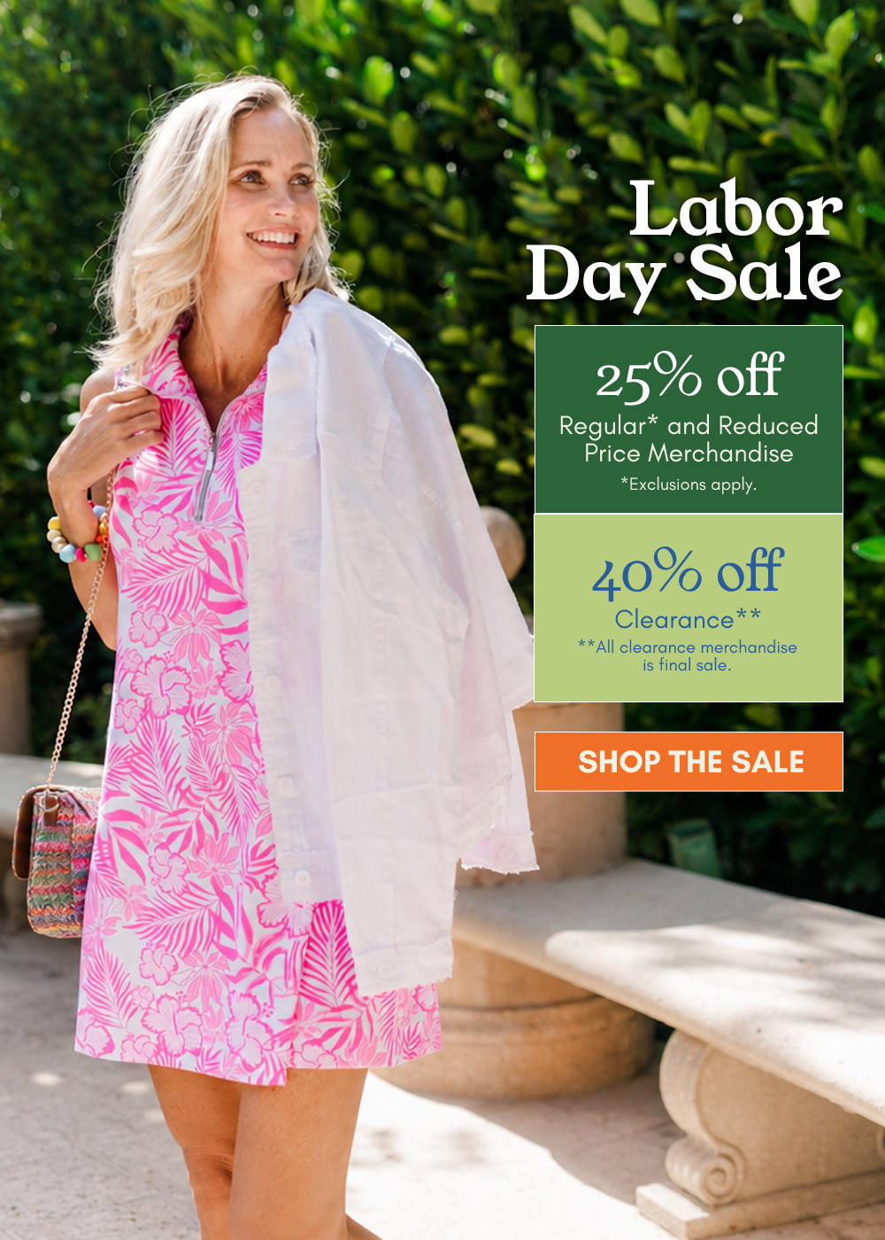 A woman stands outdoors wearing a bright pink tropical print dress and a white zip-front jacket draped over her shoulders, with a green hedge and stone steps behind her. Large promotional text on the right reads 'Labor Day Sale' with discount details and a 'SHOP THE SALE' button.