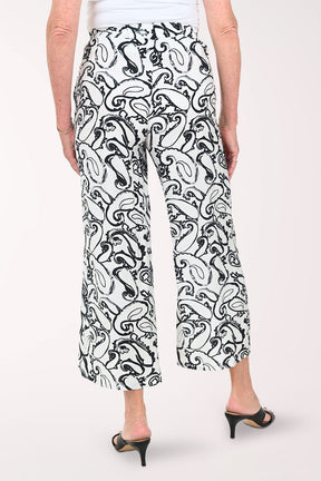Woman wearing black and white paisley cropped bottoms