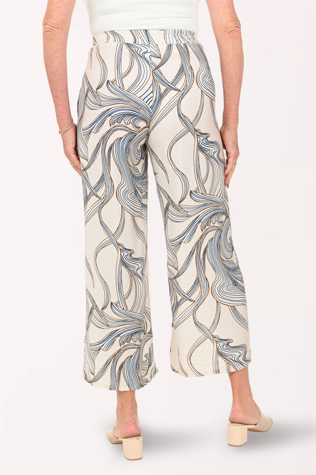 Woman wearing cropped beige pants
