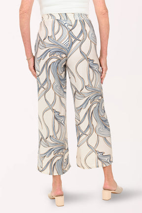Woman wearing cropped beige pants