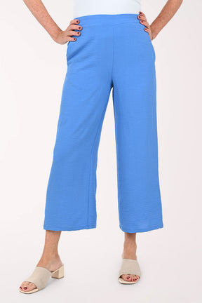 Woman wearing cobalt blue flared crop pants