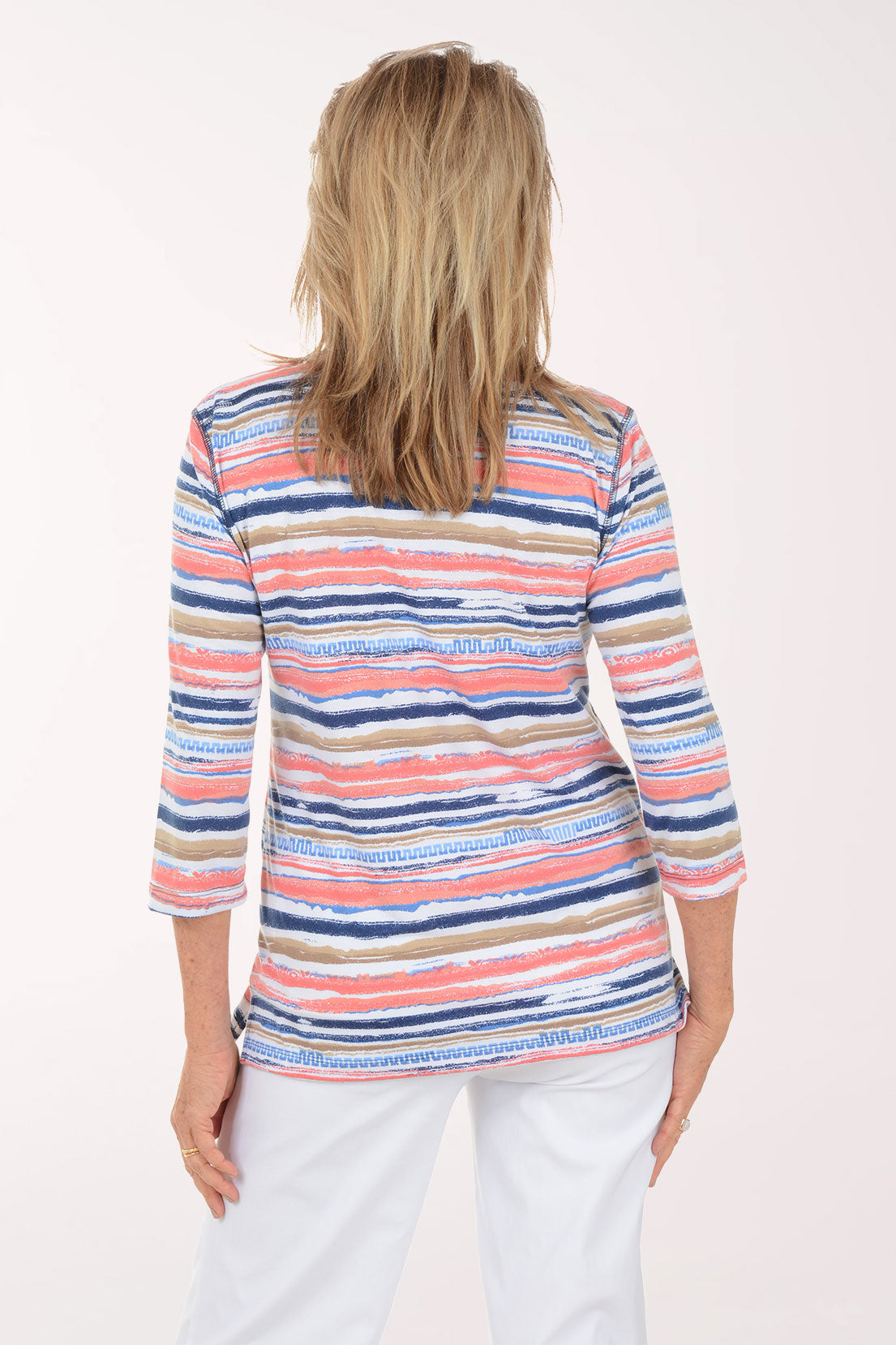 Woman wearing a colorful striped shirt on a white background