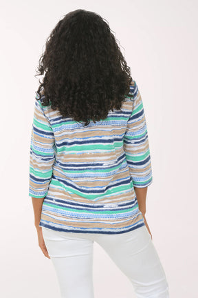 Woman wearing a colorful striped sweater on a white background