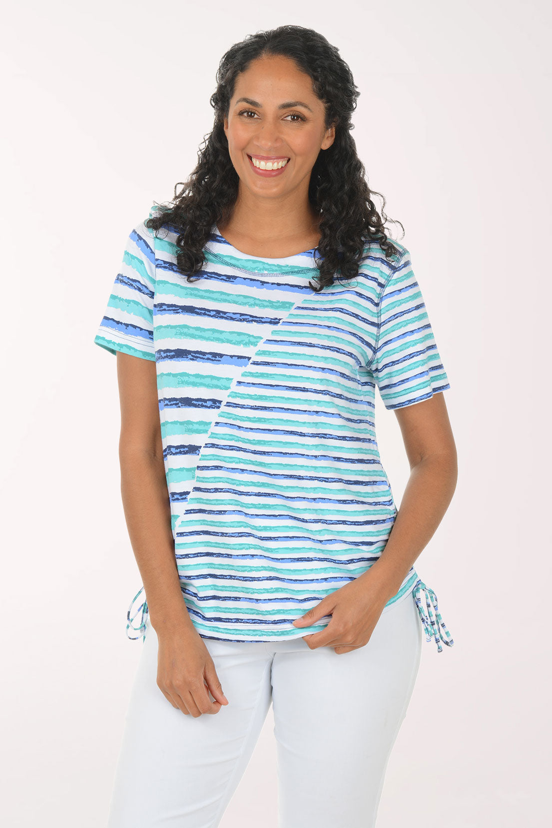 Woman wearing a striped shirt with a white background