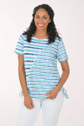 Woman wearing a striped shirt with a white background