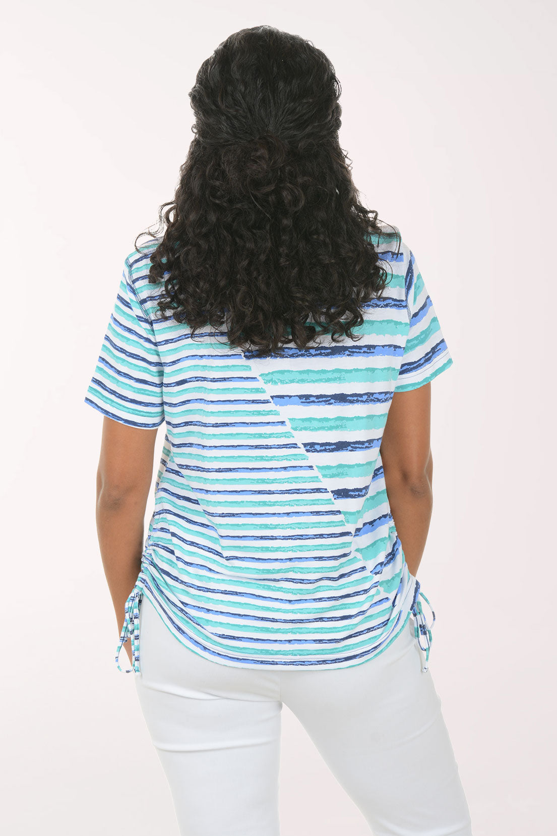 Woman wearing a striped shirt with a white background