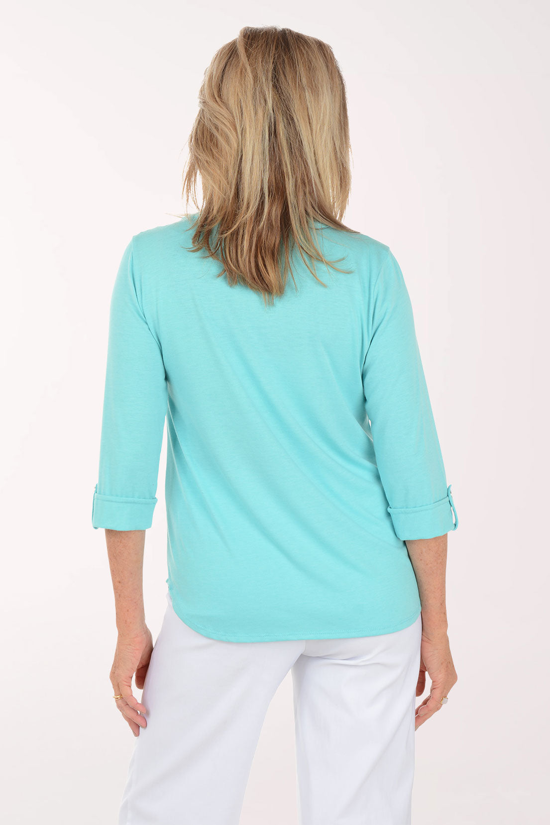 Woman wearing a light blue blouse with a white background