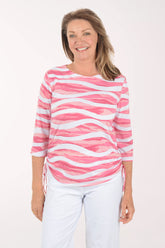 Woman wearing a pink and white striped shirt on a white background
