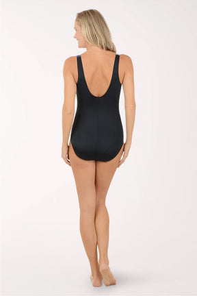 Woman wearing a colorful swimsuit on a white background