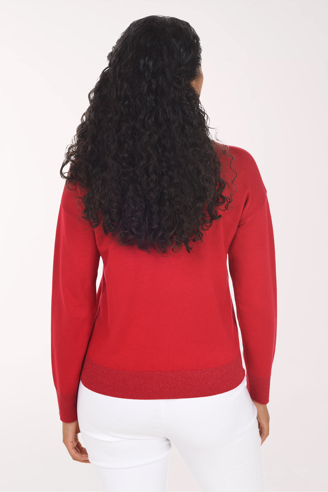 Back view of the plain red sweater with a glitter ribbed hemline.