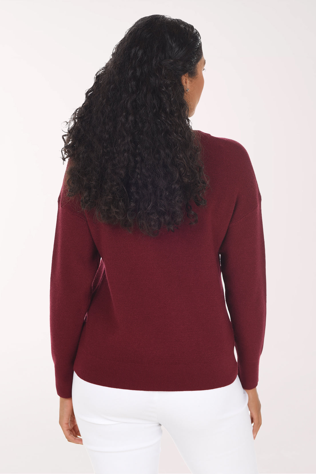 Back view of the plain wine red crewneck sweater with a straight hem.