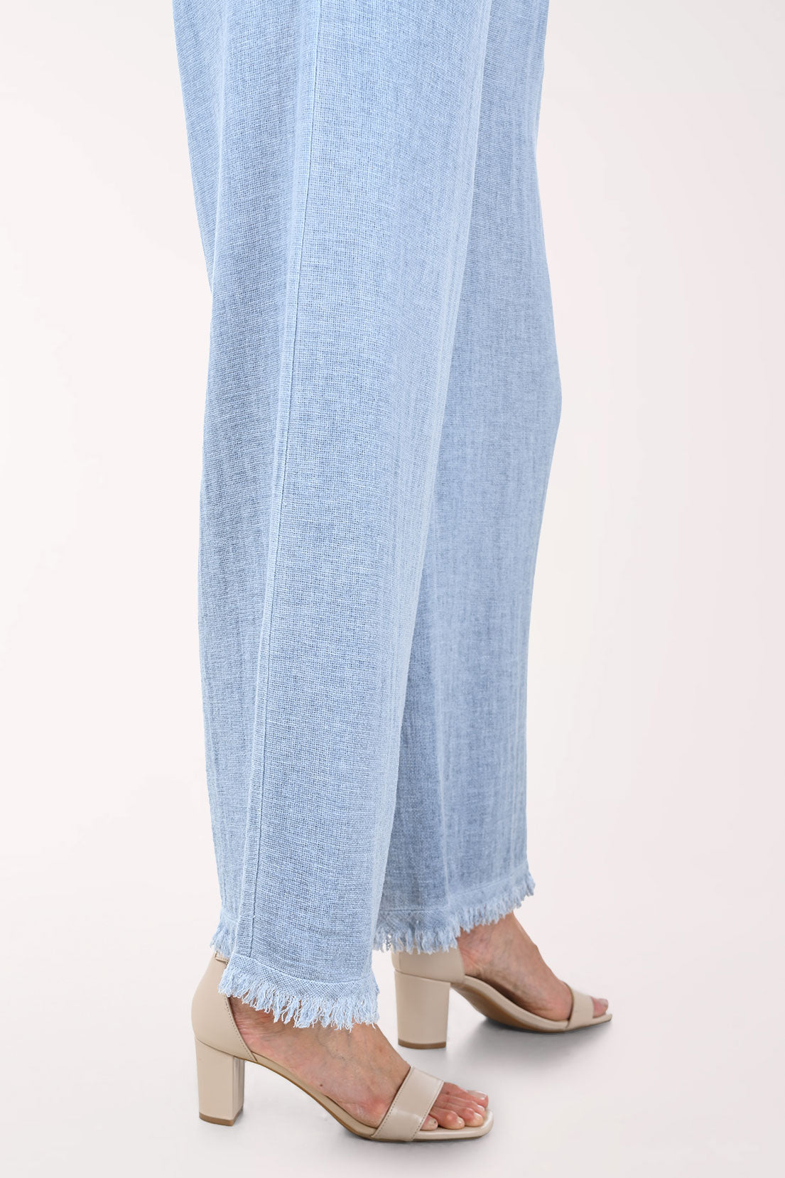 Light blue wide-leg pants worn by a person on a white background