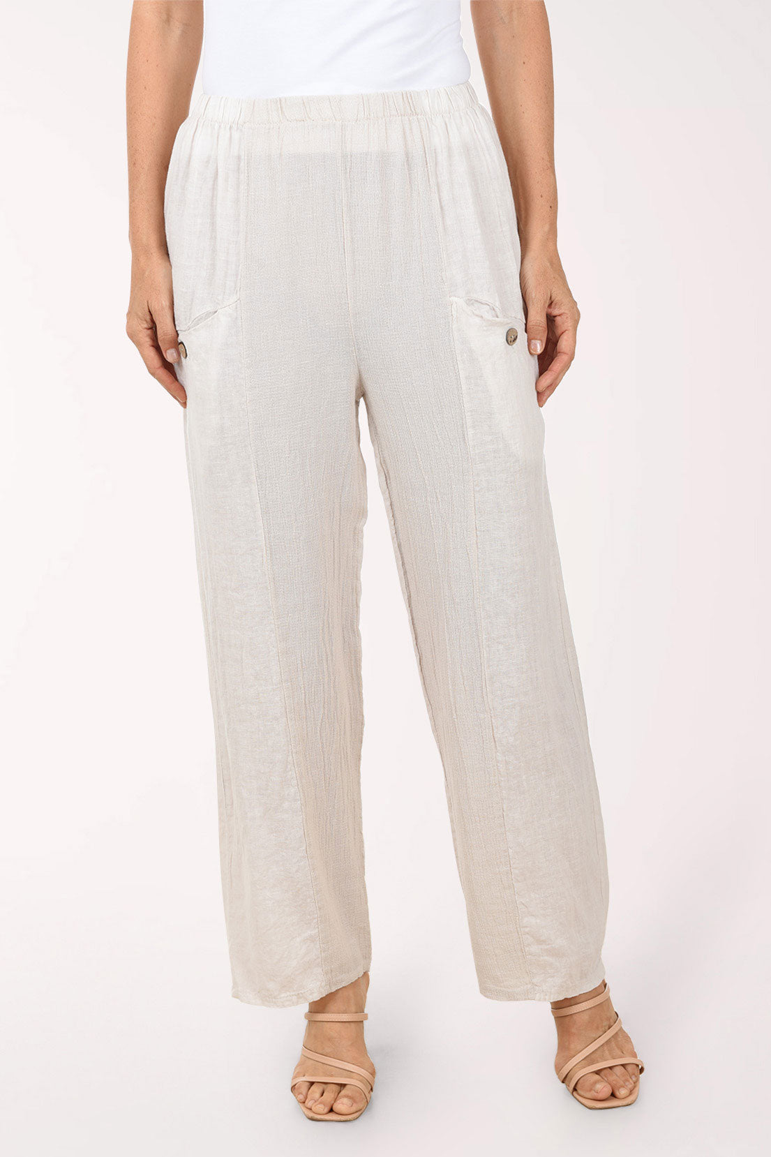 Beige wide-leg pants worn by a person on a white background