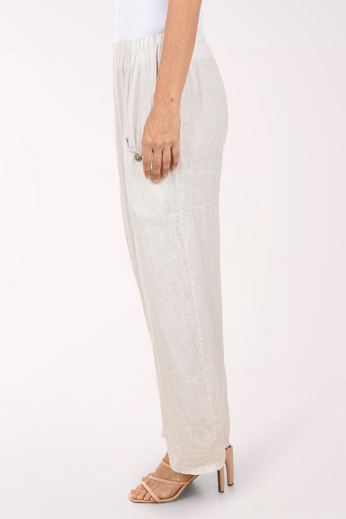 Beige wide-leg pants worn by a person on a white background