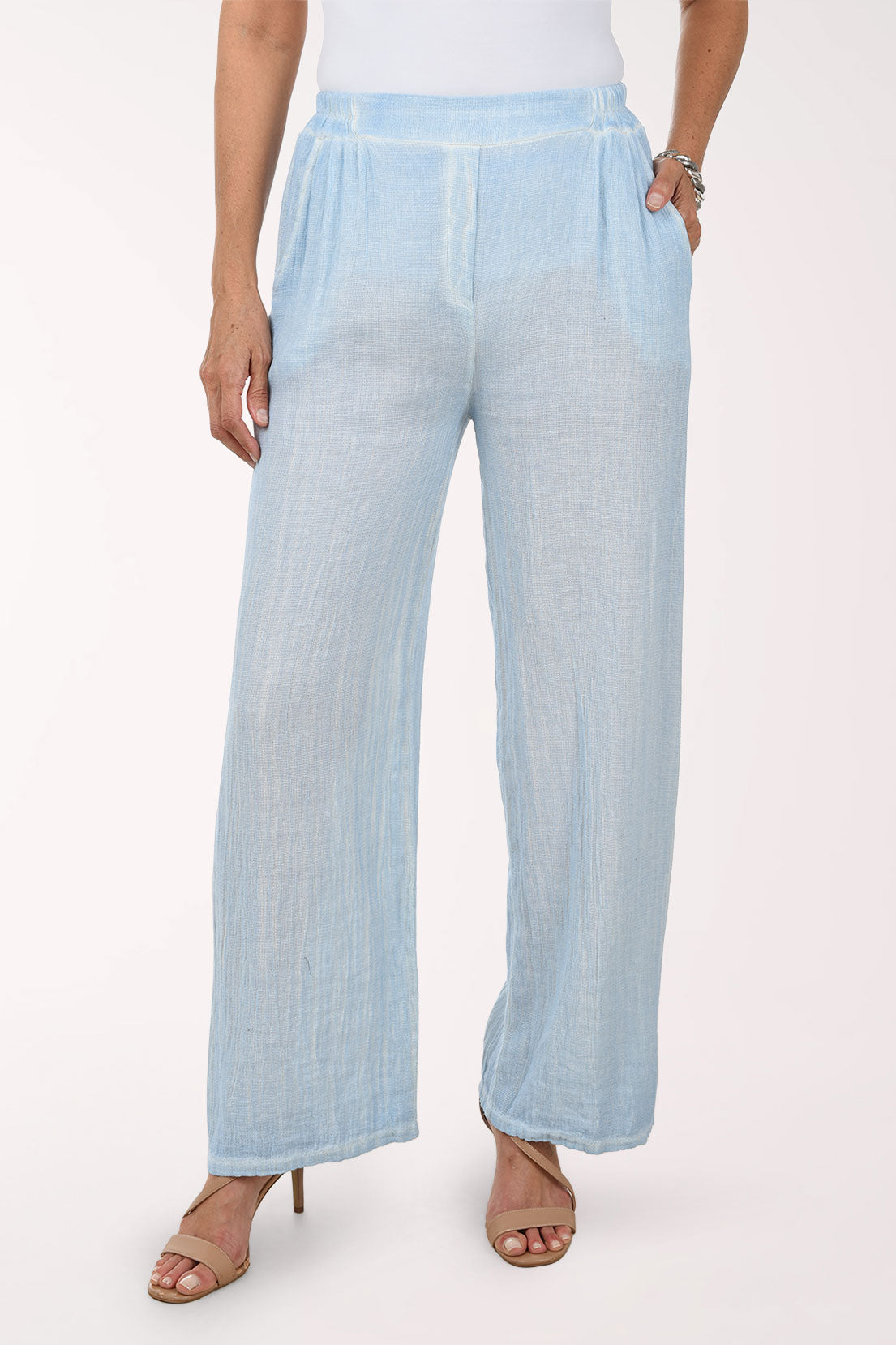 Light blue wide-leg pants worn by a person on a white background