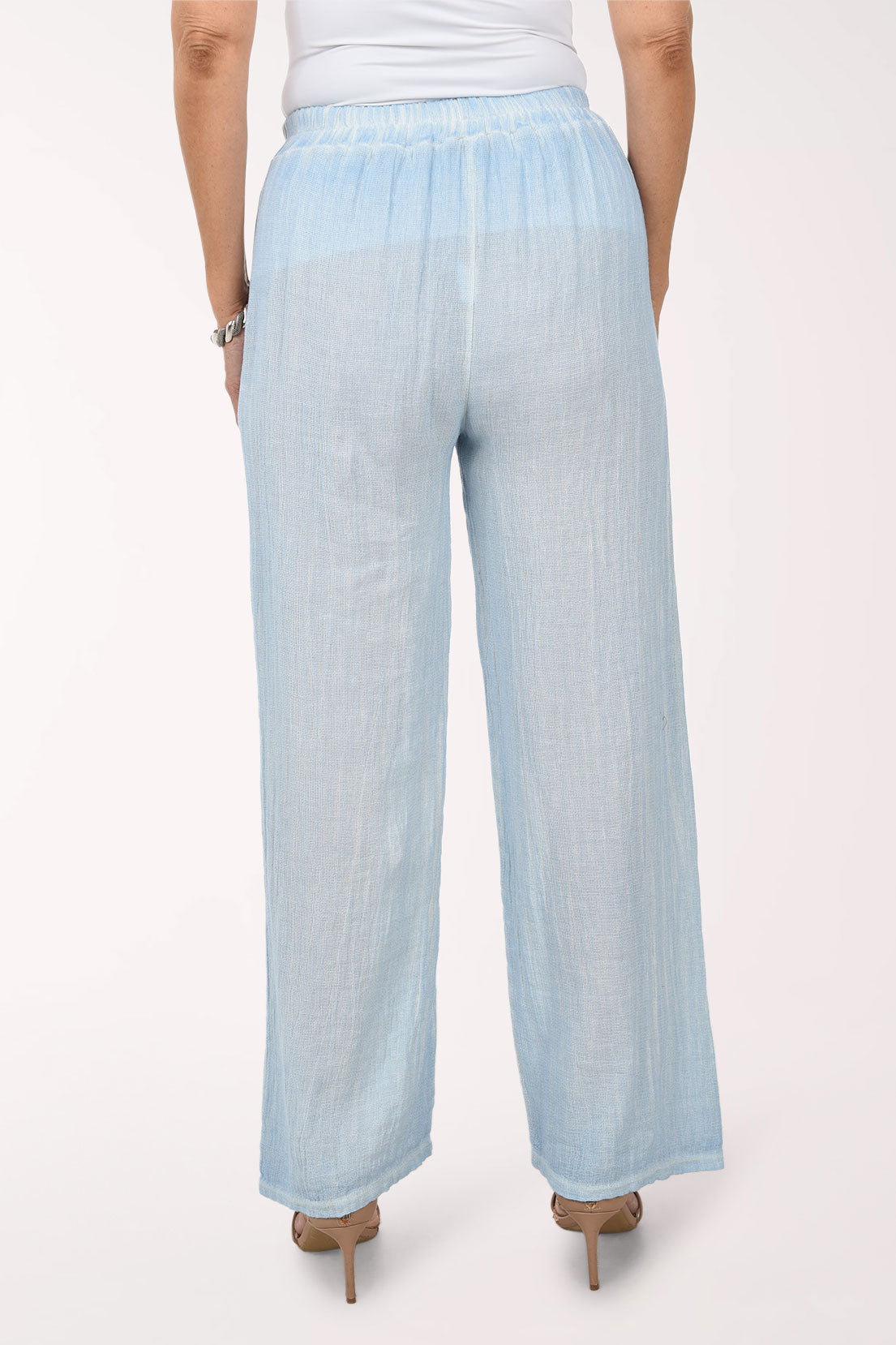 Light blue wide-leg pants worn by a person on a white background