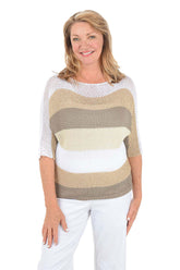 Woman wearing a striped sweater with a white background.
